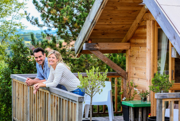 family-enjoying-vacation-in-log-cabin-shutterstock_219081379-2-585x395