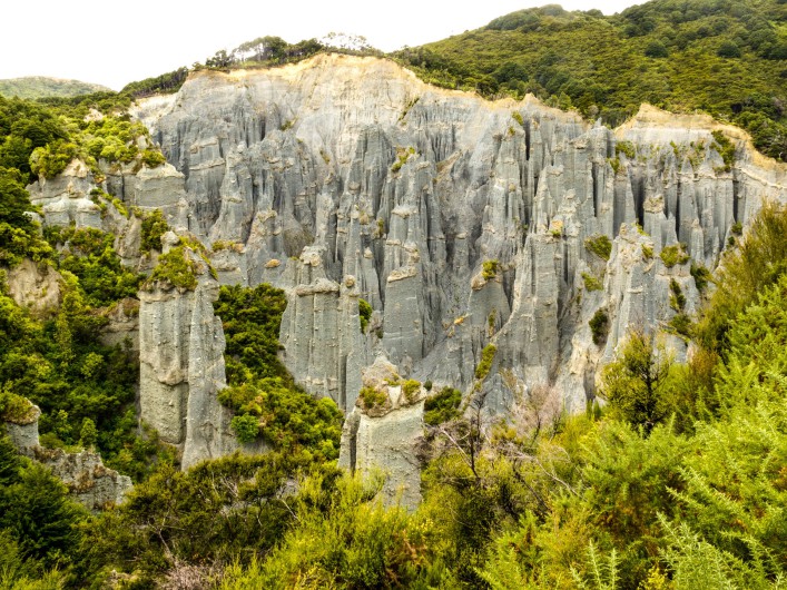 badland-erosion-of-soft-conglomerate-sediment-formations-called-putangirua-pinnacles-shutterstock_103489178-2-707x530