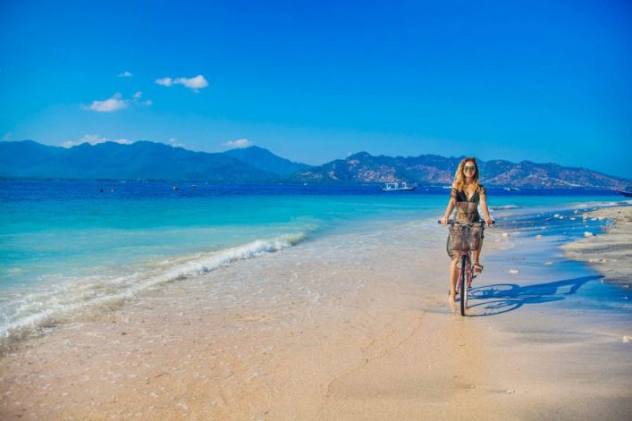 woman-relaxing-on-a-tropical-island-gili-air-shutterstock_318029165-2-e1576681066919